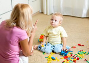 obedience scolding child toys mom son mini 300x214 - تربیت فرزندان را از چه سنی شروه کنیم؟ 15 نکته طلایی تربیتی در سنین مختلف